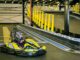 Trẻ em lái go-kart an toàn trên đường đua nhiều lớp bảo vệ